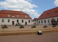 Opravené hospodářské budovy zámku